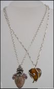 2 large pendant set silver ladies necklaces to include tigers eye stone set on the shade of a heart