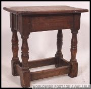A 19th century country oak peg jointed - joint stool.