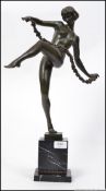 Pierre le Faguays (French 1892-1935) A large Art Deco bronze figure of a lady with a floral swag