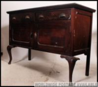 A 1930's mahogany sideboard dresser raised on cabriole legs with 2 drawers over cupboard