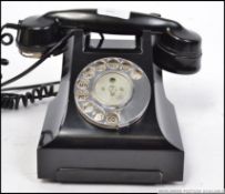 A vintage mid century Bakelite pyramid telephone,