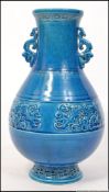 A 19th century blue Chinese vase, of bulbous form with waisted neck and round base.
