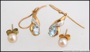 A pair of ladies 9ct gold aquamarine and diamond set earrings.