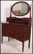 An Edwardian mahogany inlaid dressing table chest.