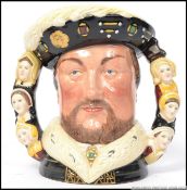 Henry VIII D6888: A Royal Doulton twin handles character toby jug 1409/1991.