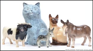 A collection of ceramic animal figures to include a Melba donkey, SylvaC cat,