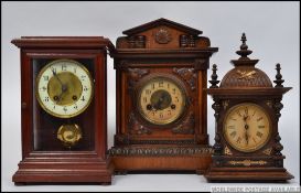 A vintage Junghans gingerbread clock in spire case together with another smaller Junghans clock in
