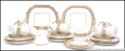 An extensive ten person bone china tea service by Salisbury China having a decorative gilt