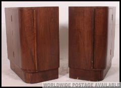 A pair of 1930's Art Deco mahogany bedside cabinets with bow front locker cabinet doors and shelves.