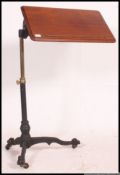 A Victorian Mahogany and cast iron Lectern / Bed Tray Table with an adjustable cast iron and brass