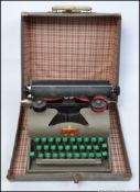 A vintage mid century Childrens Lilliput vintage typewriter and original carrying case.