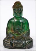 A 20th century decorative buddha figure with gilt painting.