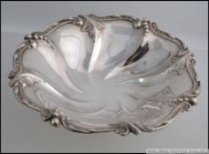 A silver hallmarked Oyster dish on raised feet bearing hallmarks for James Deakin & Sons, Sheffield,
