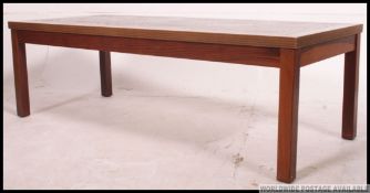 A 1970's retro teak Danish style coffee / occasional table with inset tile top in the Fat Lava