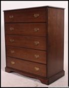 An excellent quality Stag ( Georgian style ) mahogany tall chest of drawers being raised on a