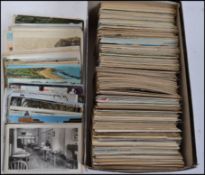 A collection of postcards dating from the early 20th century to include many topographical,