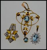 A collection of 3 9ct gold ladies pendants to include Art Nouveau style and 2 others.