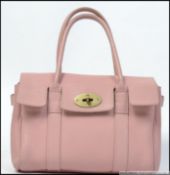 A lady's Mulberry Bayswater handbag in pink leather complete with dust bag