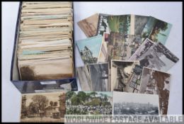 Old postcards in shoebox. All appear to be from UK and mostly pre 1950s between the wars.