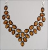 A large white metal 925 silver and smokey quartz necklace