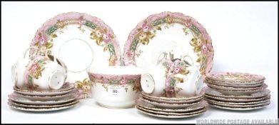 A Victorian chintz Staffordshire part tea service comprising cups, saucers,