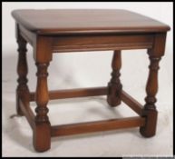 An Ercol Golden Dawn beech and elm wood side - lamp table.