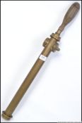 A fabulous Coopers Patent protector brass garden sprayer of large form with oak turned handle,