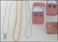 A collection of silver jewellery items to include 3 pairs of boxed earrings all set with semi