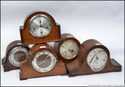A collection of early 20th century mantel clocks to include an Art Deco foreign walnut clock,