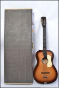 A vintage 1950's / 1960's steel stringed acoustic guitar (AF - split to top) housed within a good
