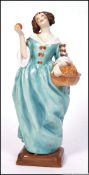 A Royal Worcester ' Sweet Nell of Old Drury ' blue dress, model No.