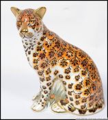 A Royal Crown Derby large paperweight Leopardess limited to 950 pieces with gold button.