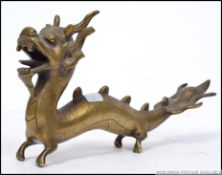 A stunning 20th century Chinese brass Dragon pen holder,