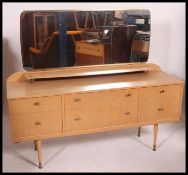 A retro 1970's light wood dressing table chest of drawers.