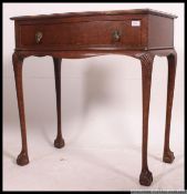 A mid century oak serpentine side table,