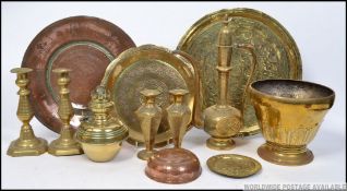 A collection of brasswares to include Edwardian candlesticks, Indian brass charger,