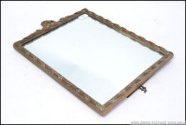 A good quality early century easel backed barbola mirror having gilt moulded frame with panel and