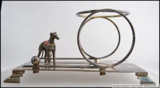 A stunning 1930's Art Deco silver plated greyhound desk tidy.