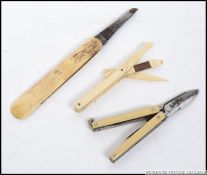 A bone pocket knife, together with another,