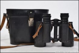 A pair of 20th century good quality USSR / Russian 12 x 40 binoculars complete in the leather carry