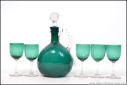 A set of 19th century teal coloured glass sherry glass and decanter set.
