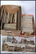 An unsorted box of old postcards (approx 550), three photo albums, quantity of loose photos,