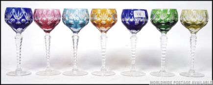 A fabulous set of 7 Bohemian crystal coloured glass wine glasses.
