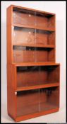 A large 20th century mahogany lawyers stacking bookcase cabinet of sectional form with glass facia