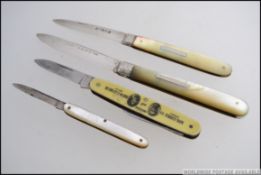 A collection of 4 silver and white metal hallmarked fruit knives - pen knives,