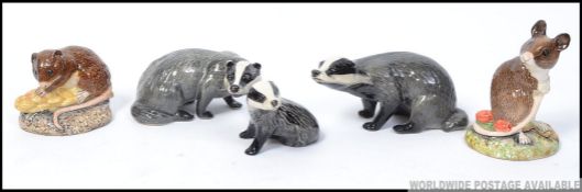 A group of 5 Beswick animals to include a badger family trio a mouse and a vole all stamped Beswick