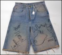Inspiral Carpets - A pair denim Shorts signed by all of Inspiral Carpets as well as having a hand