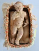 A stunning 19th century intricately detailed putti cherub of wooden and plaster form set within a