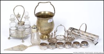 A collection of silver plated items to include napkin rings toast rack,