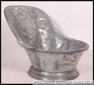 A 19th century mahogany gentlemans tin bath of shaped form being pressed metal / tin